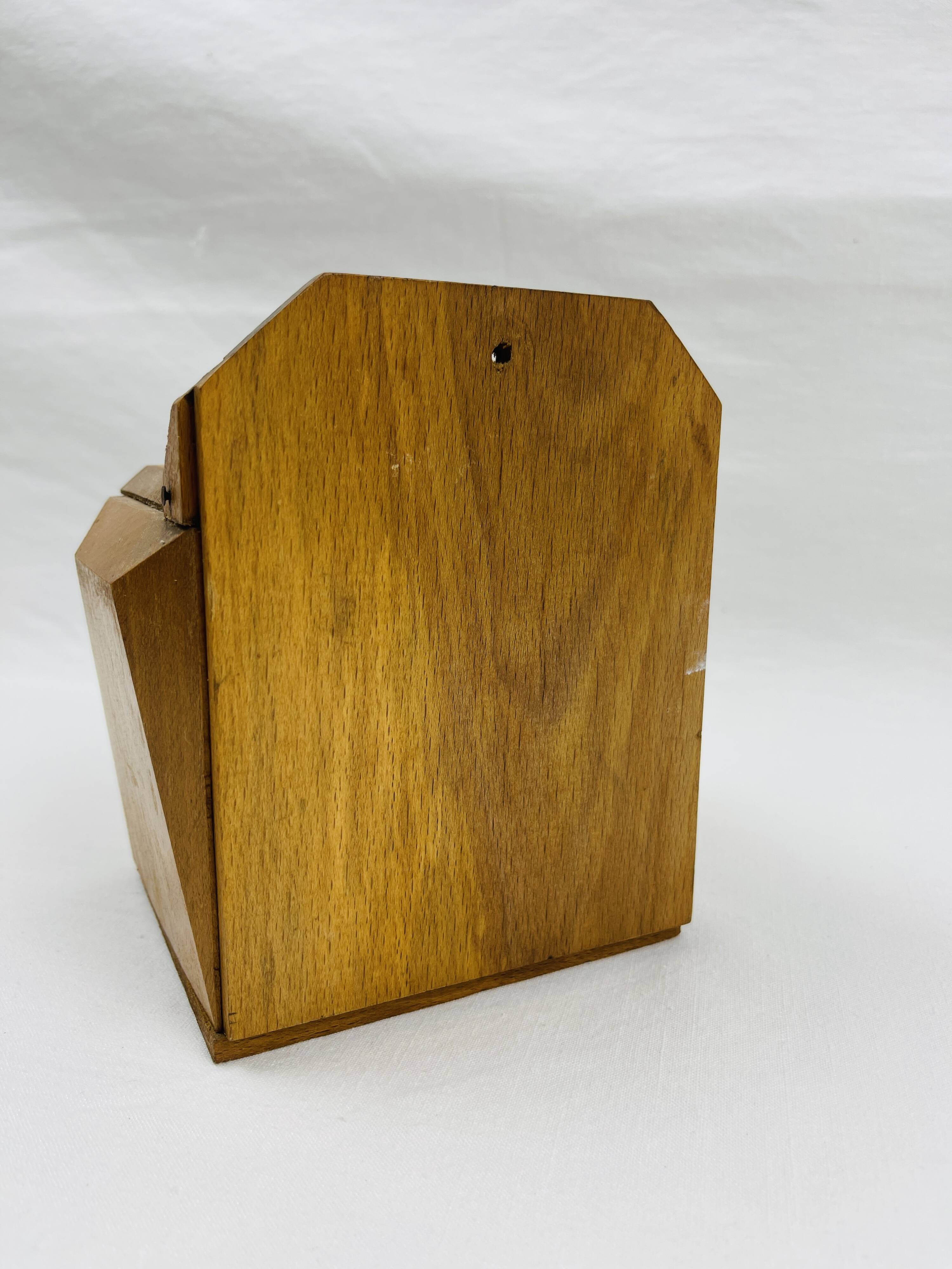 Old wooden salt box with red and white checkerboard decoration