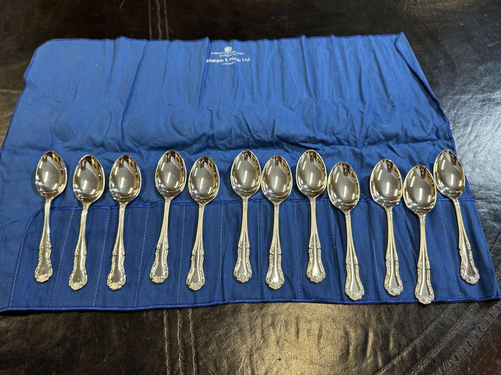 Set of 12 dessert spoons by Mappin and Webb in silver plate.