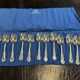 Set of 12 dessert spoons by Mappin and Webb in silver plate.