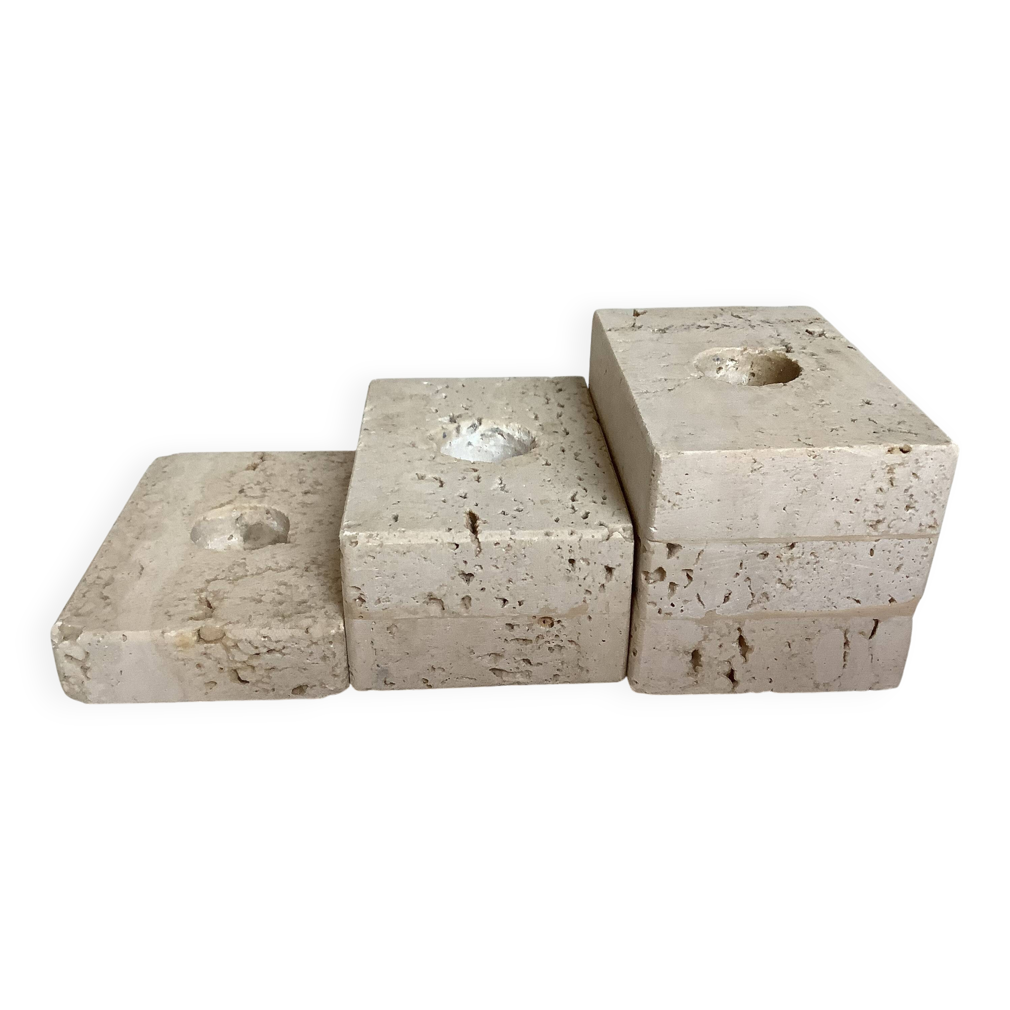 Trio of travertine candlesticks
