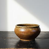 Vintage glazed stoneware bowl or planter in rustic wabi-sabi style.