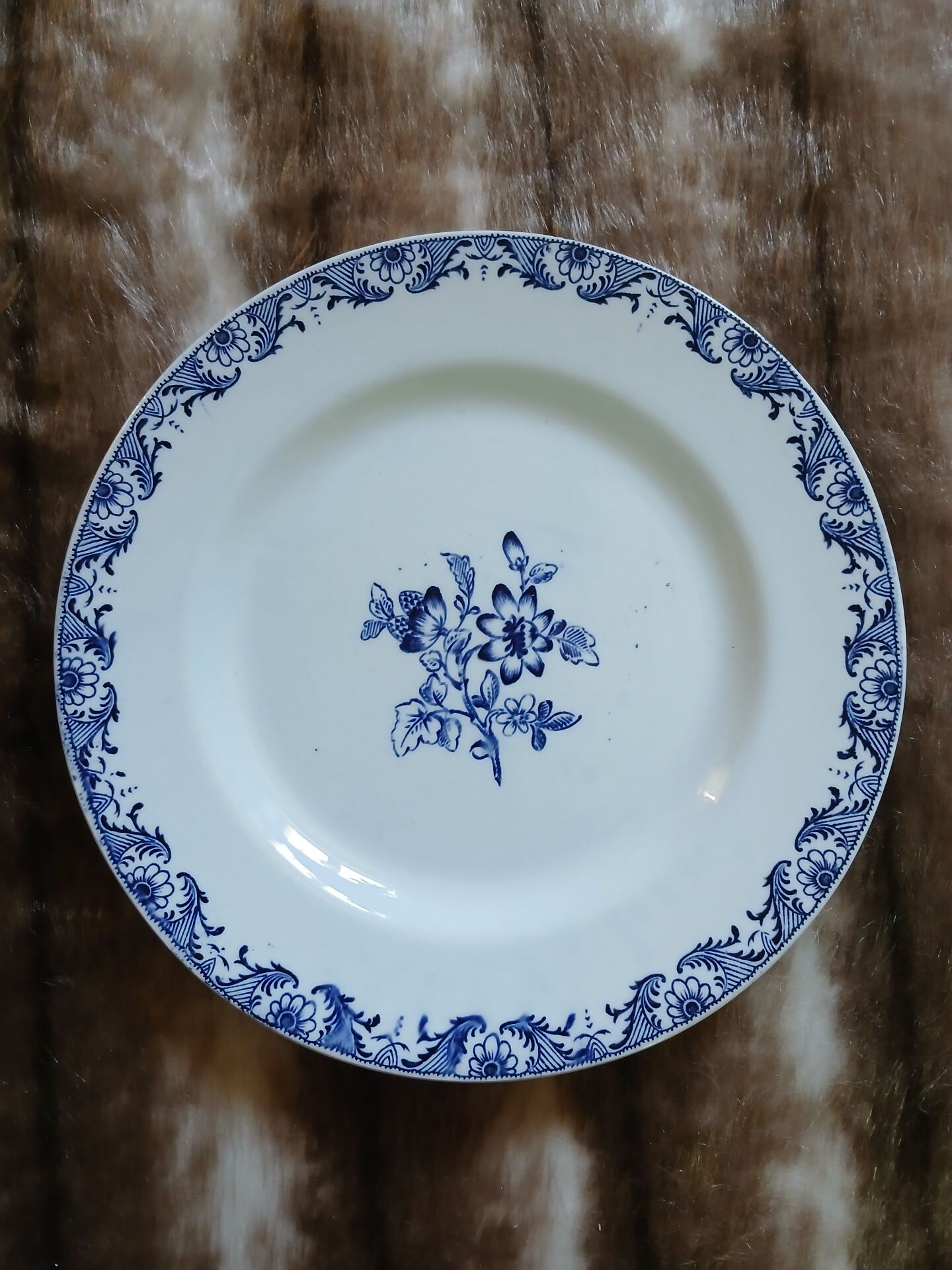 13 mismatched flat plates in ironstone