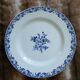 13 mismatched flat plates in ironstone