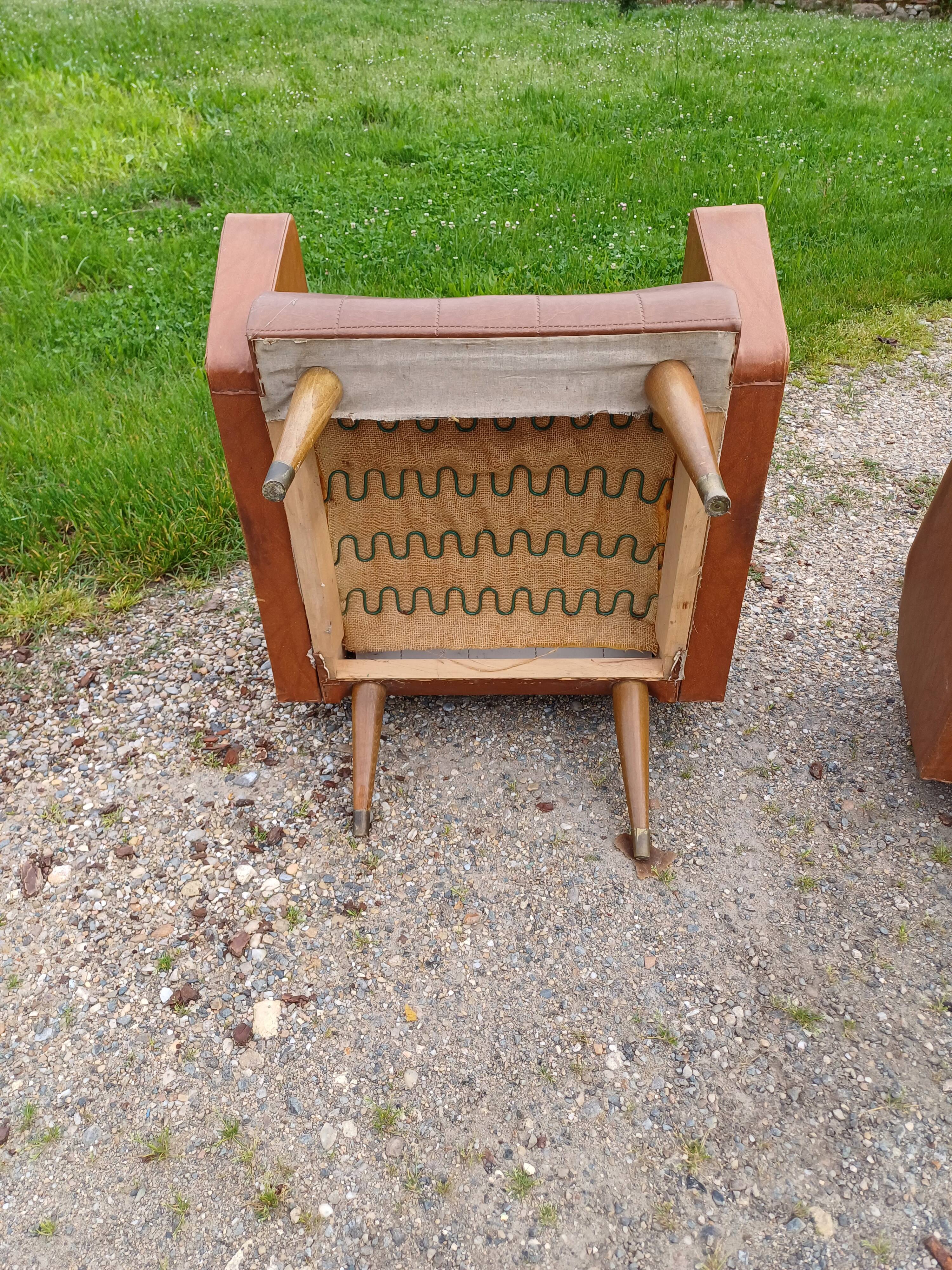Paire de fauteuils vintage en skaï marron