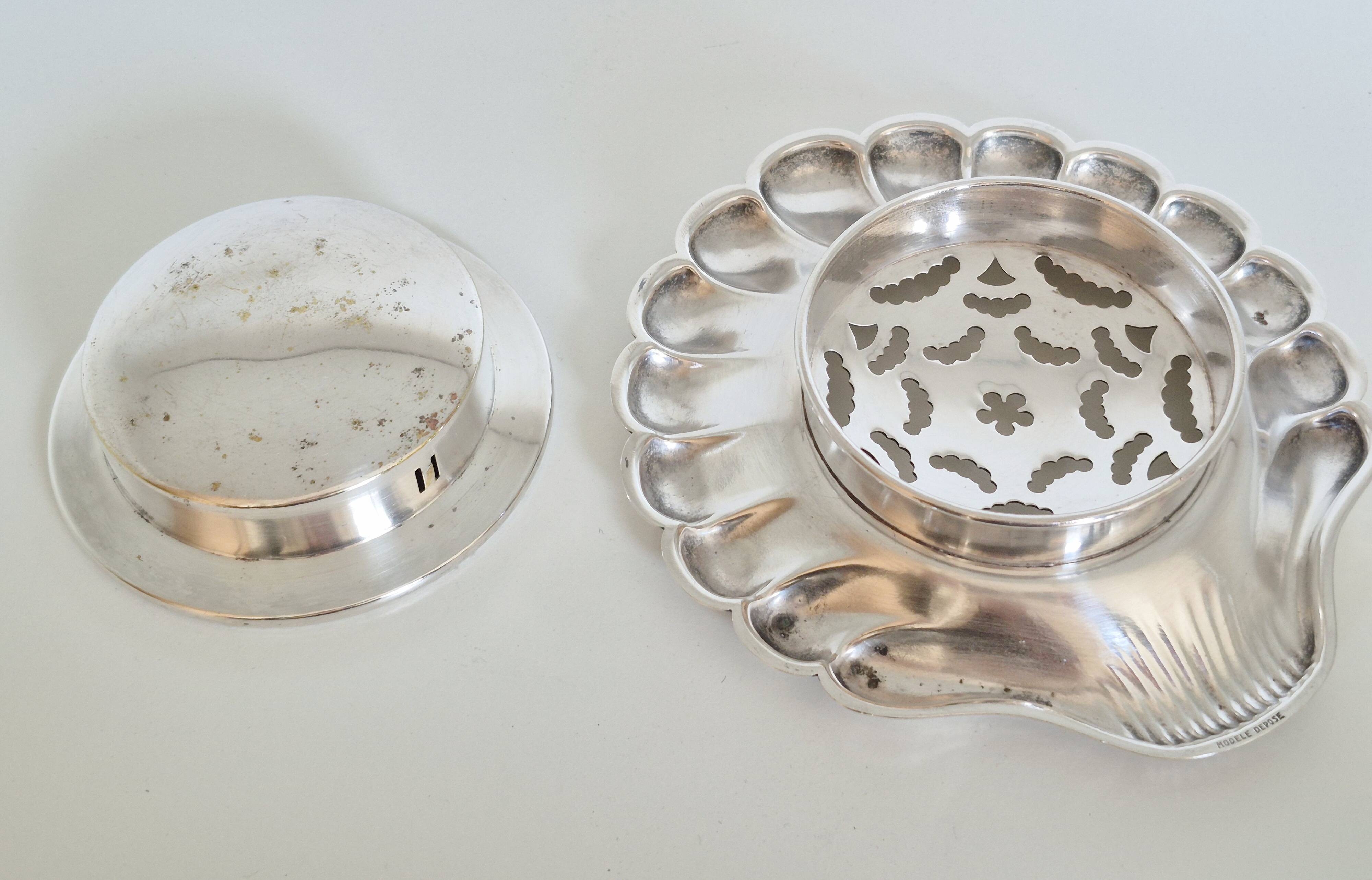 Silver scallop shell butter dish.