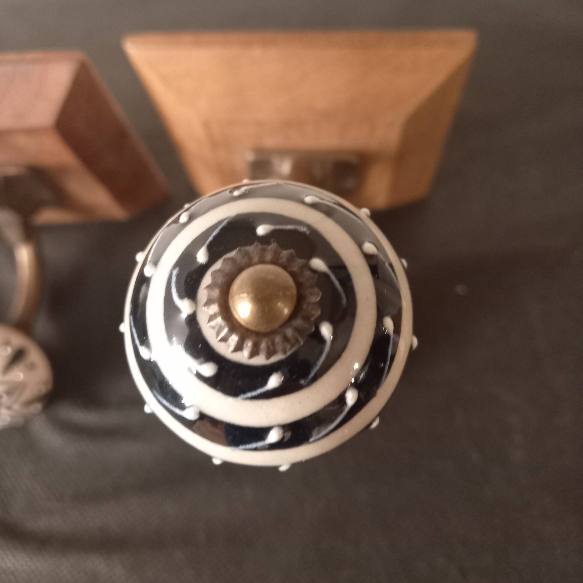 Duo of coat hooks, coat racks in wood and bronze porcelain