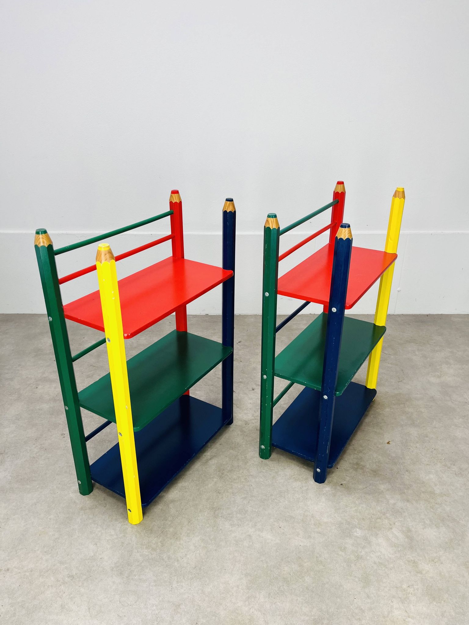 Pair of pencil-style shelves by Pierre Sala for children.