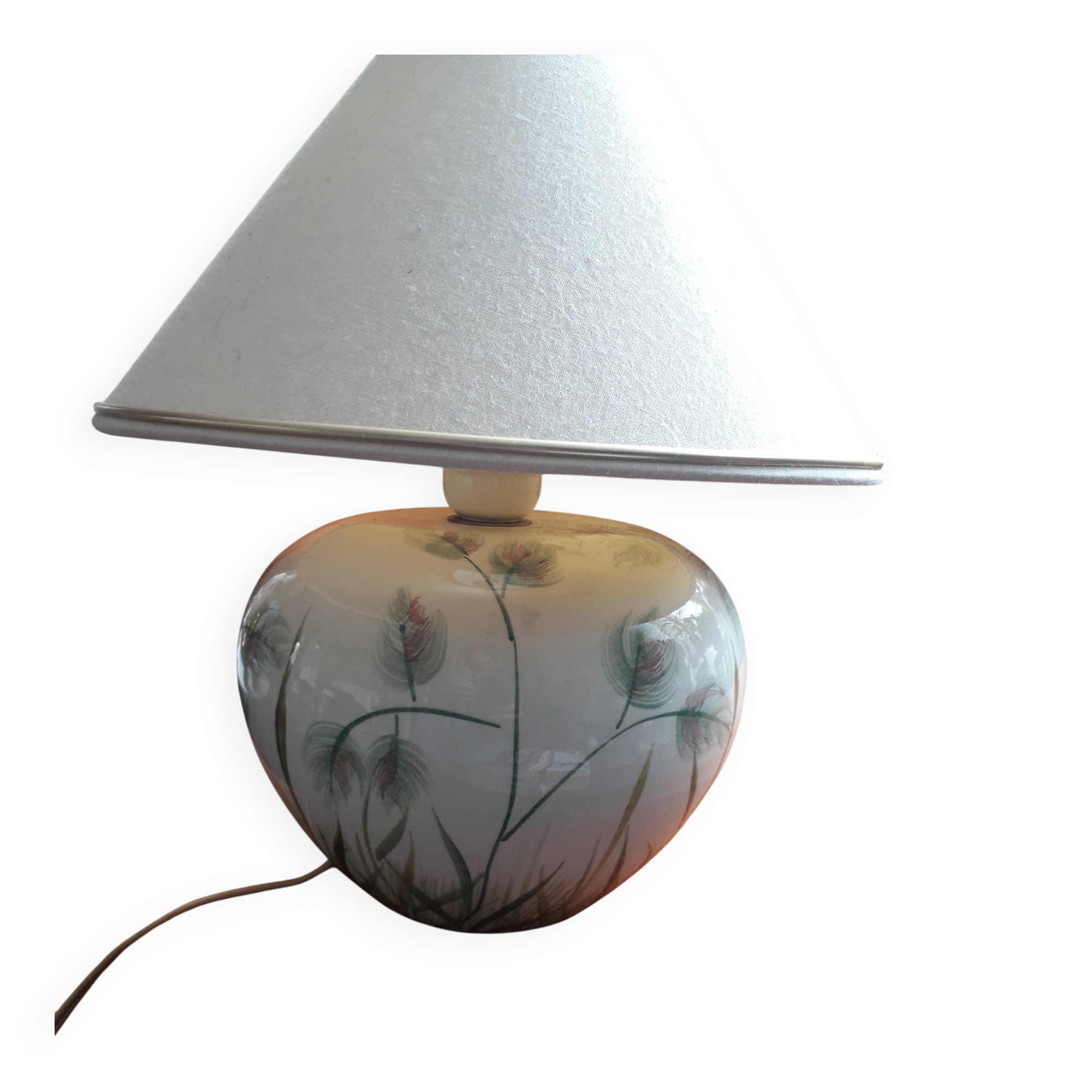 Antique ceramic lamp with floral decoration.