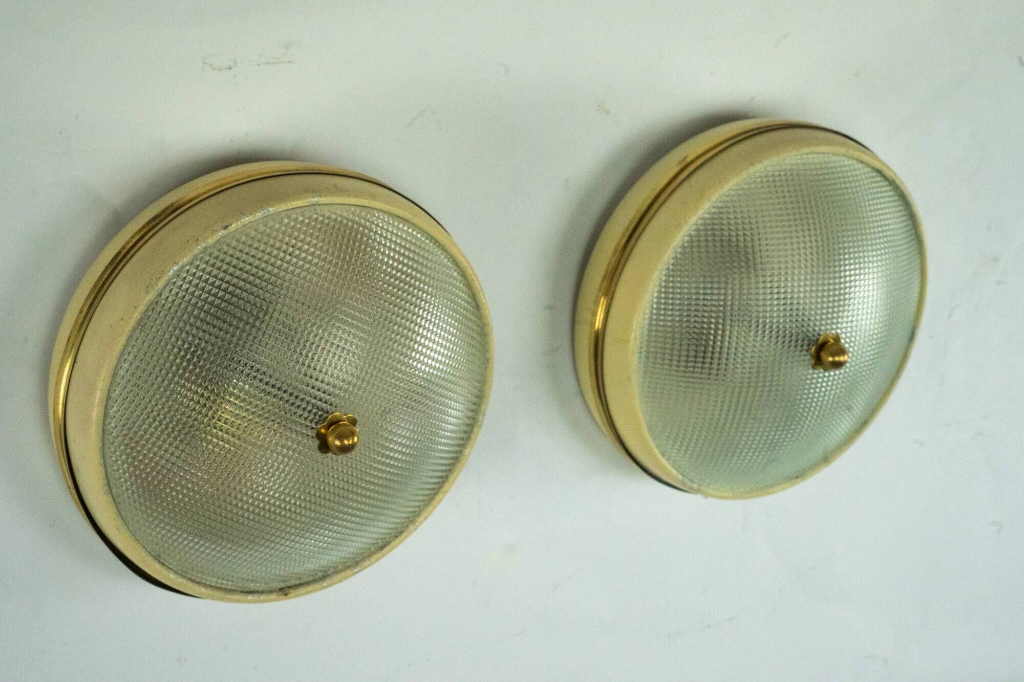 Lumi Milano, pair of wall or ceiling lamps in glass, brass and lacquer, 50s