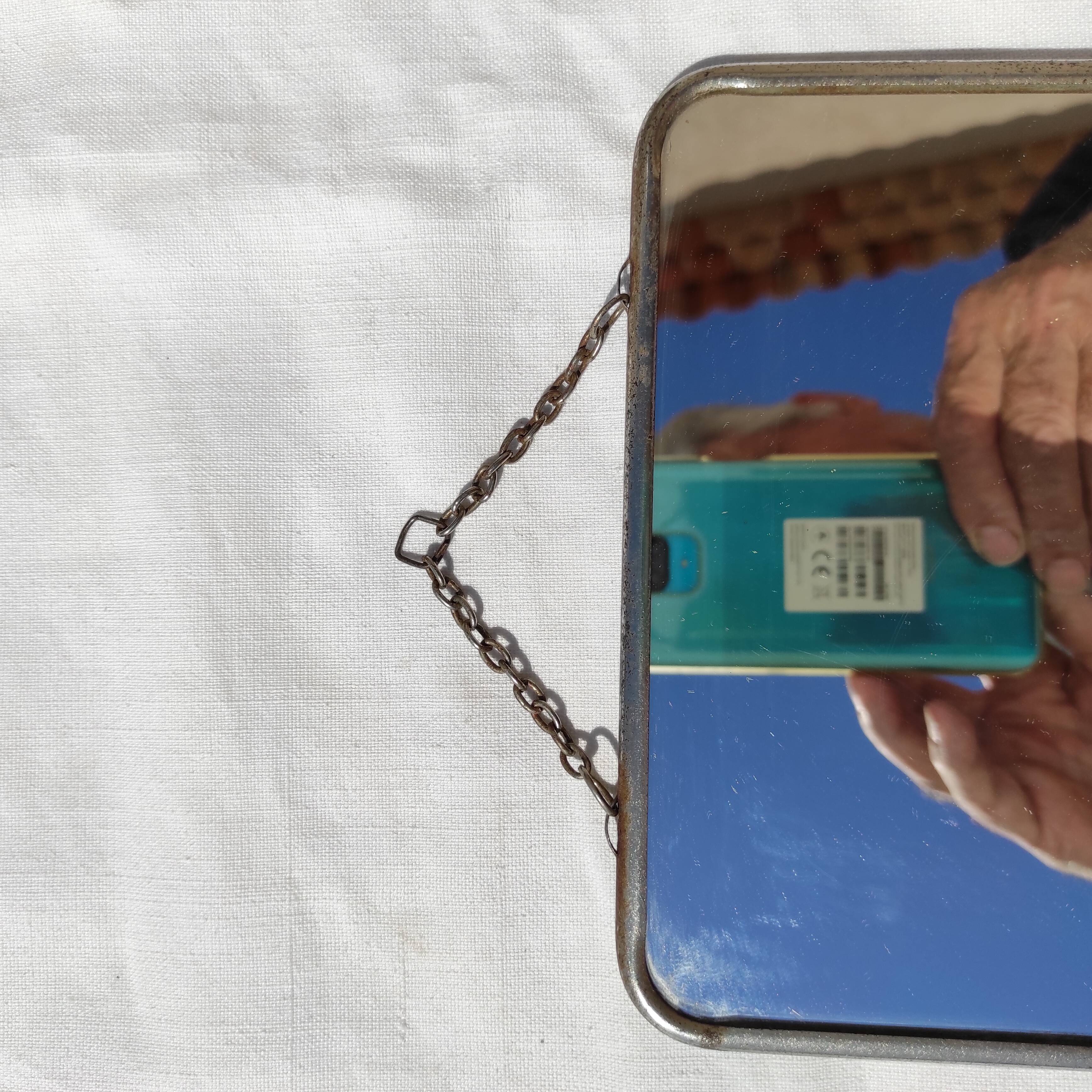 Barbier mirror with its chain around the 1950s vintage