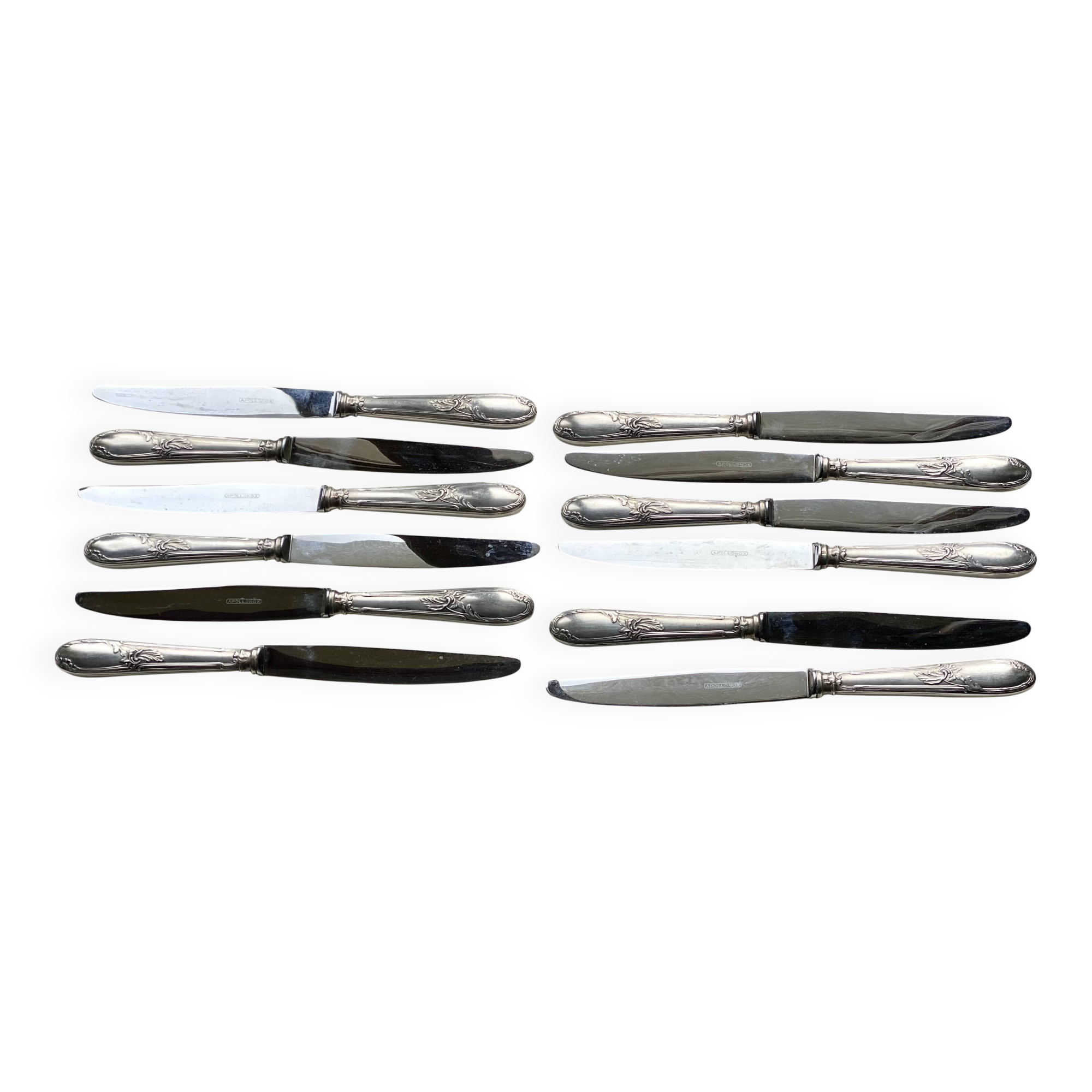 Set of 12 silver-plated metal table knives in Art Nouveau style.