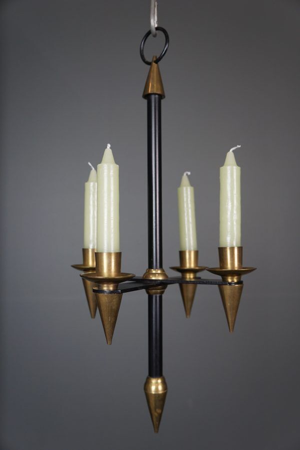 Candle holder in black metal and brass