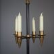 Candle holder in black metal and brass