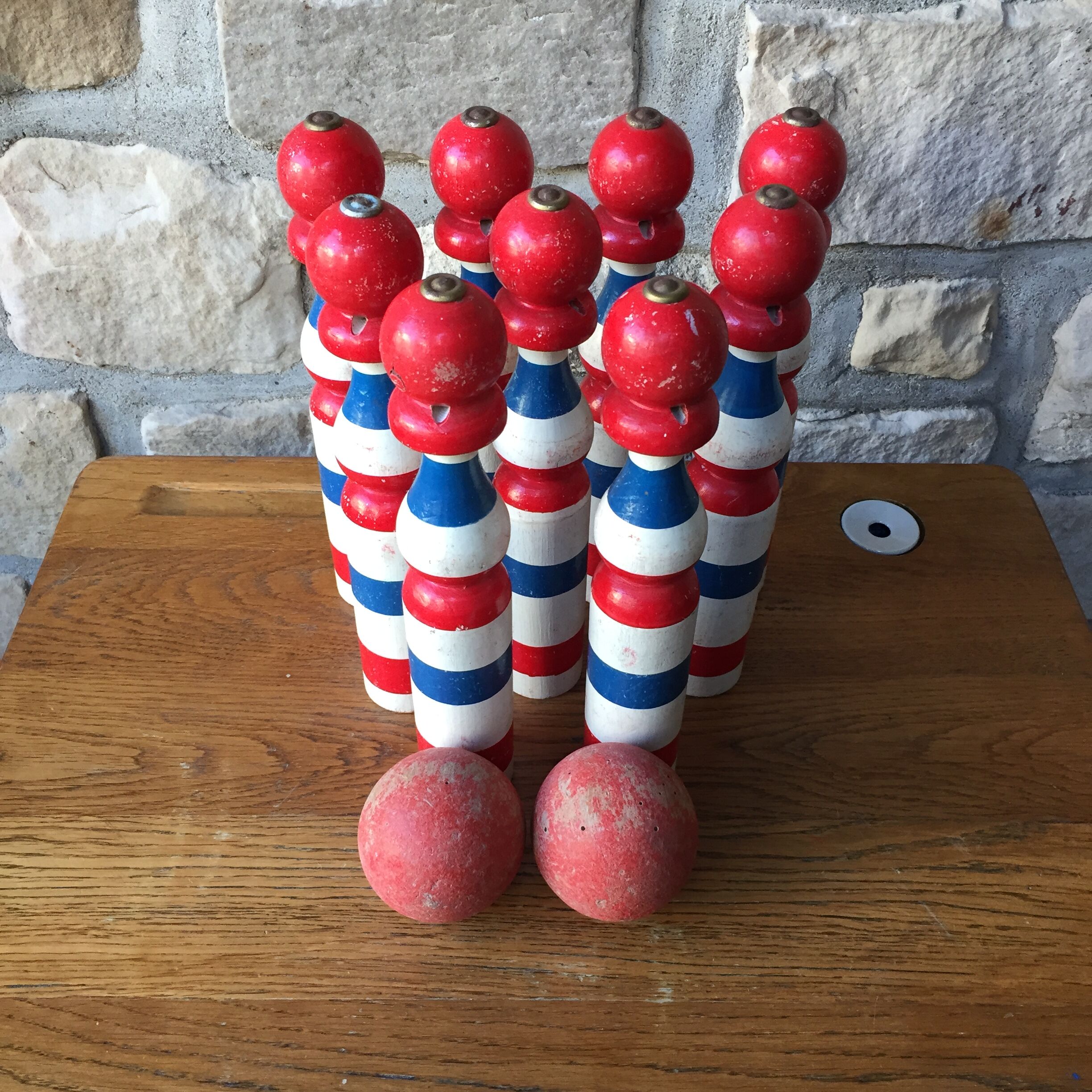 Old vintage wooden bowling game triclore plus two balls