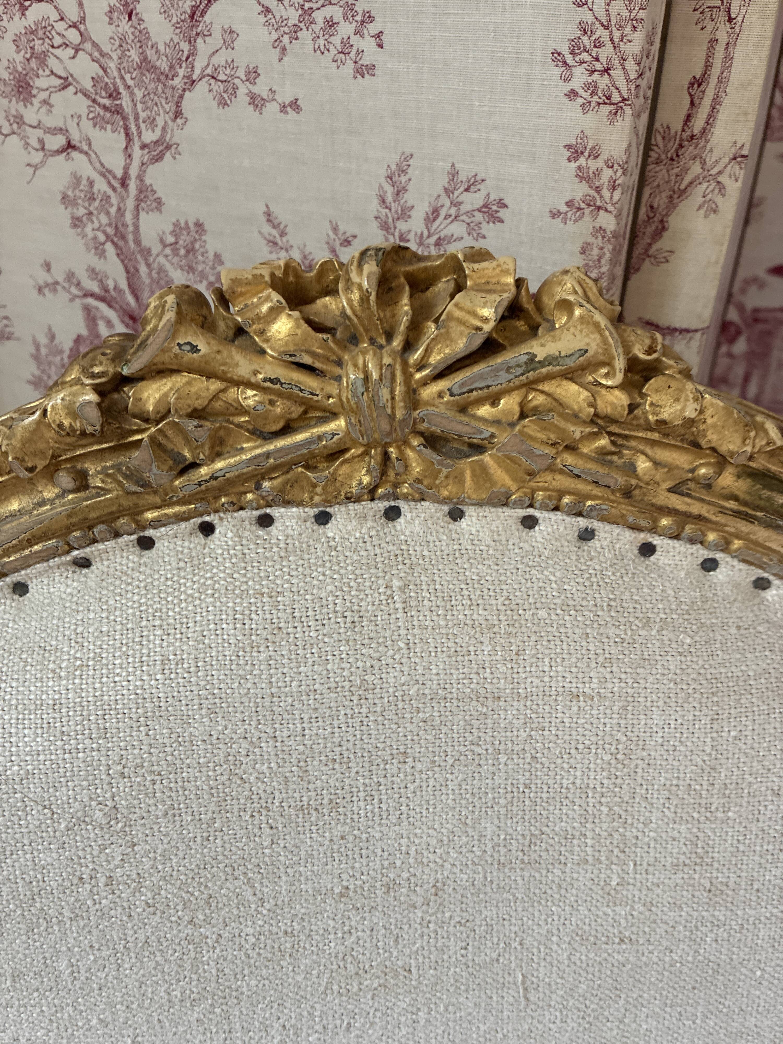 Large cabriolet armchair in Louis XVI style with gilded wood.