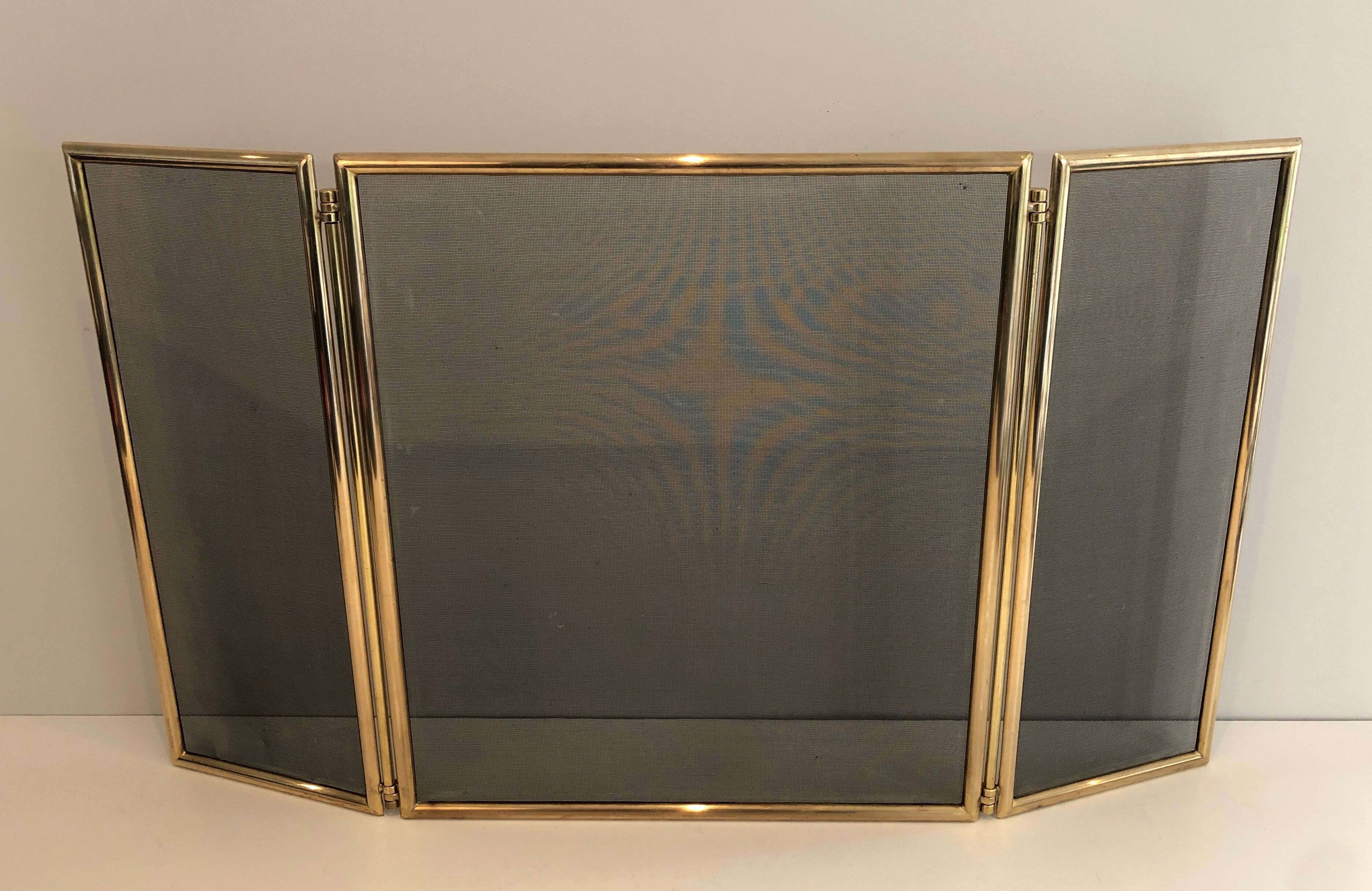 Brass and wire mesh firewall. french work. around 1970