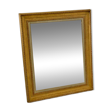 Wood and gilded stucco mirror in Louis XVI style