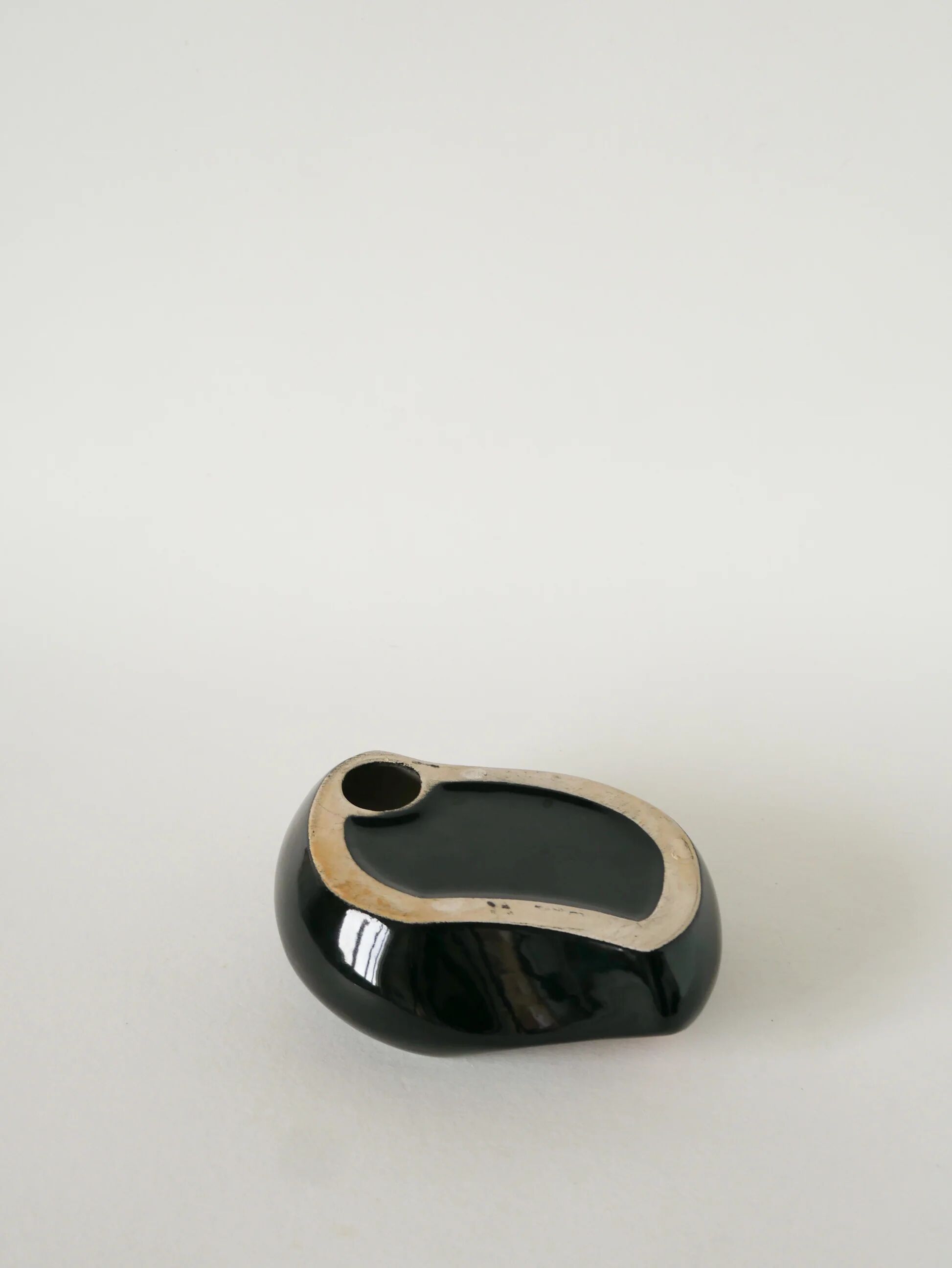 Ceramic catchall, free form, black and pink, 1970.