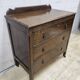Antique chest of drawers on wheels with wood carving (key top drawer)