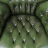 Large green cowhide Chesterfield office chair in English style on wheels