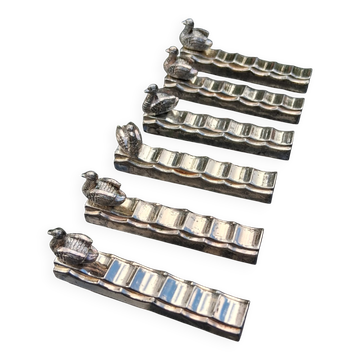 6 animal-shaped metal knife rests in very good condition.