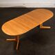 Oval dining table with 2 extensions.