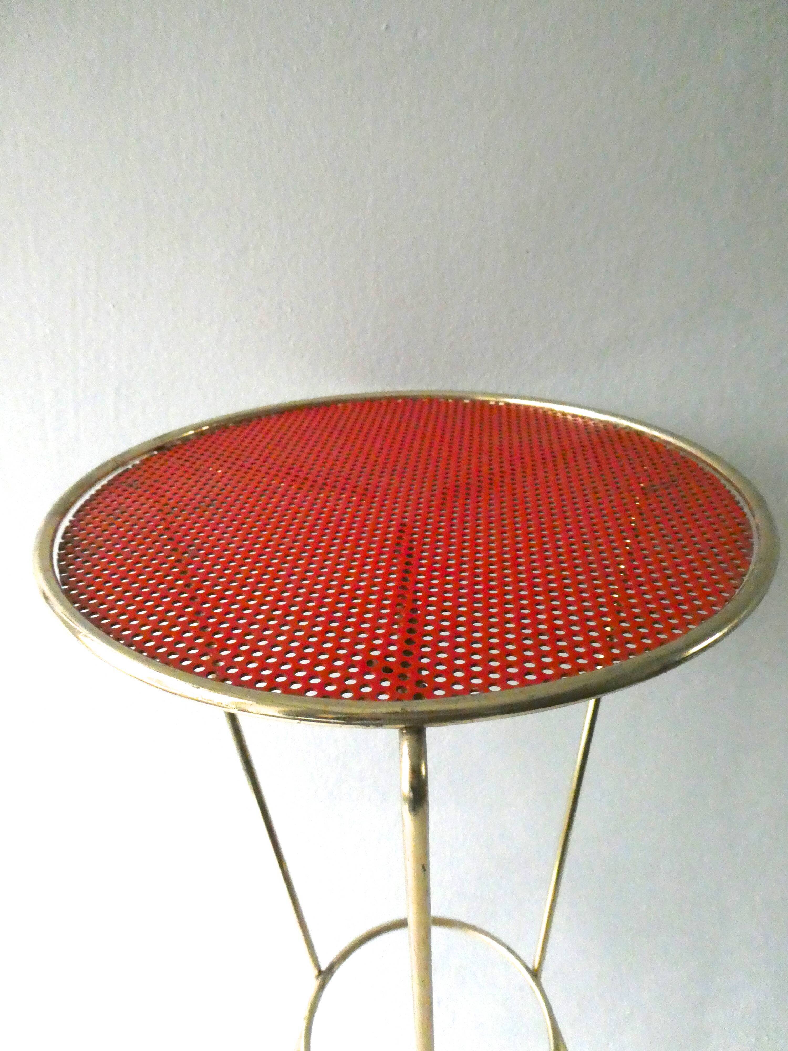 Tripod healing in gold metal and perforated metal from the 1960s