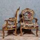Pair of carved and gilded cabriolet armchairs in the Louis XV style.