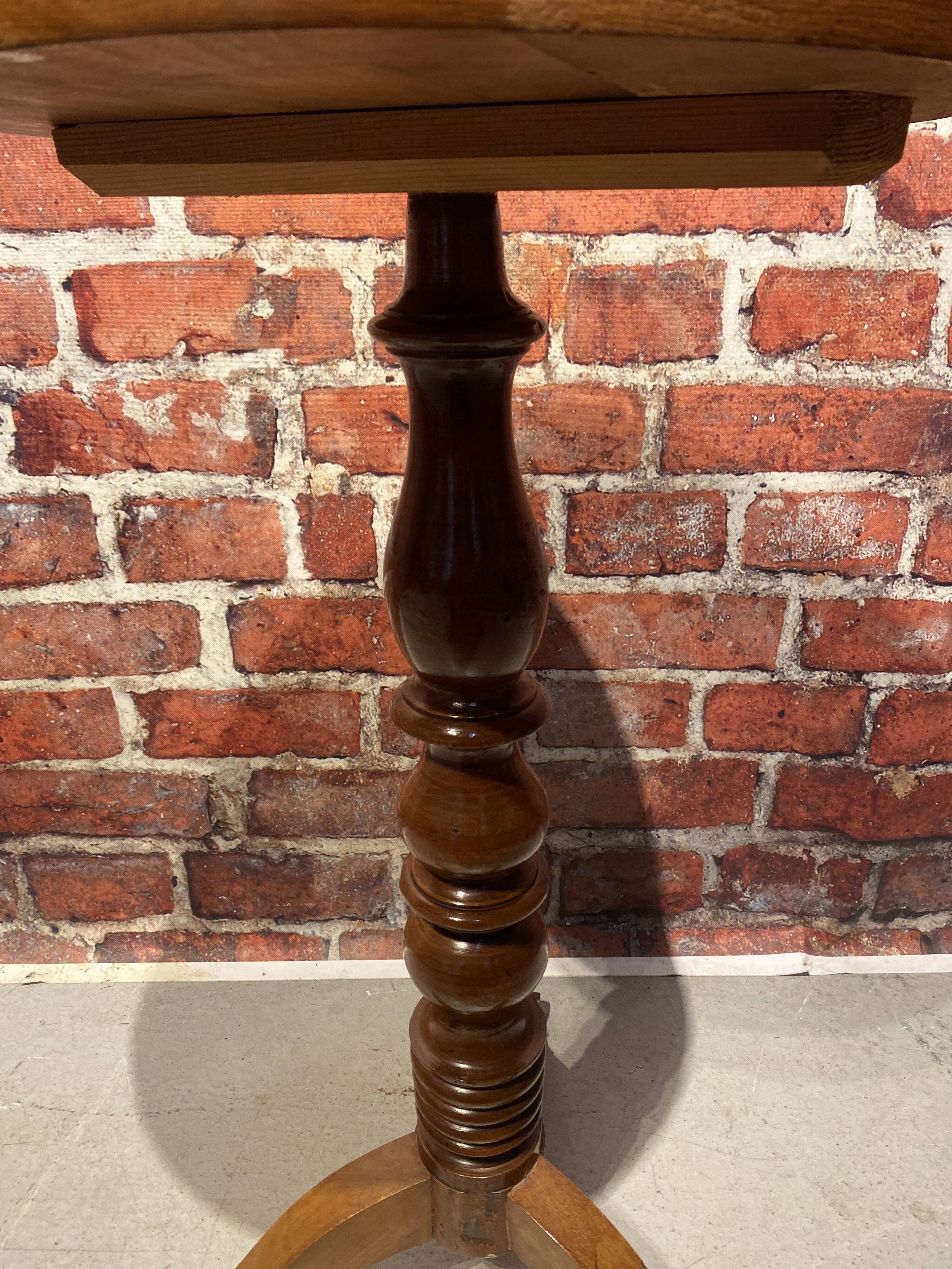 Wooden pedestal table