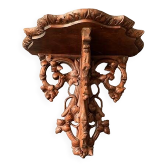 Old wall console in carved wood, 19th century black forest