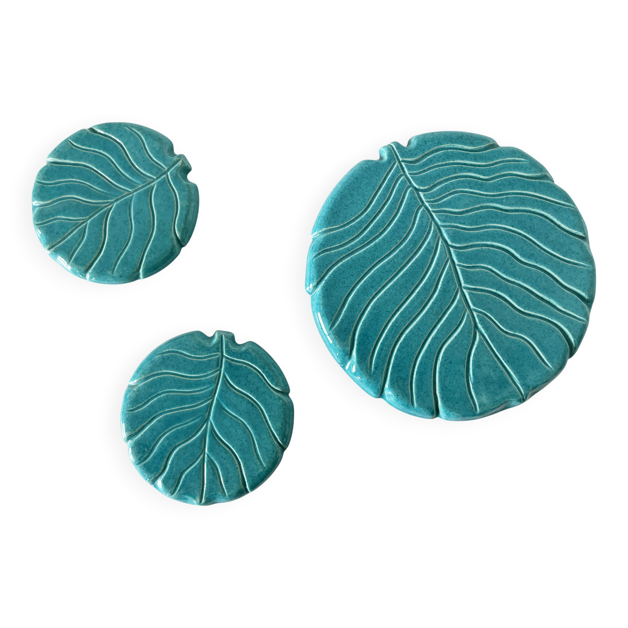 Ceramic trivet and bottle coaster from the 1950s.