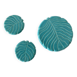 Ceramic trivet and bottle coaster from the 1950s.