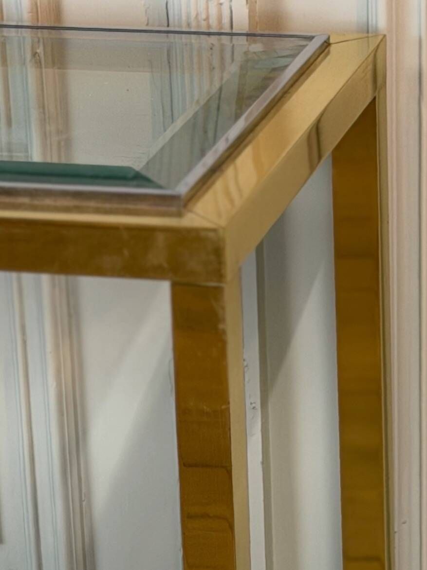 Golden and chrome metal console, bevelled glass, circa 1980.