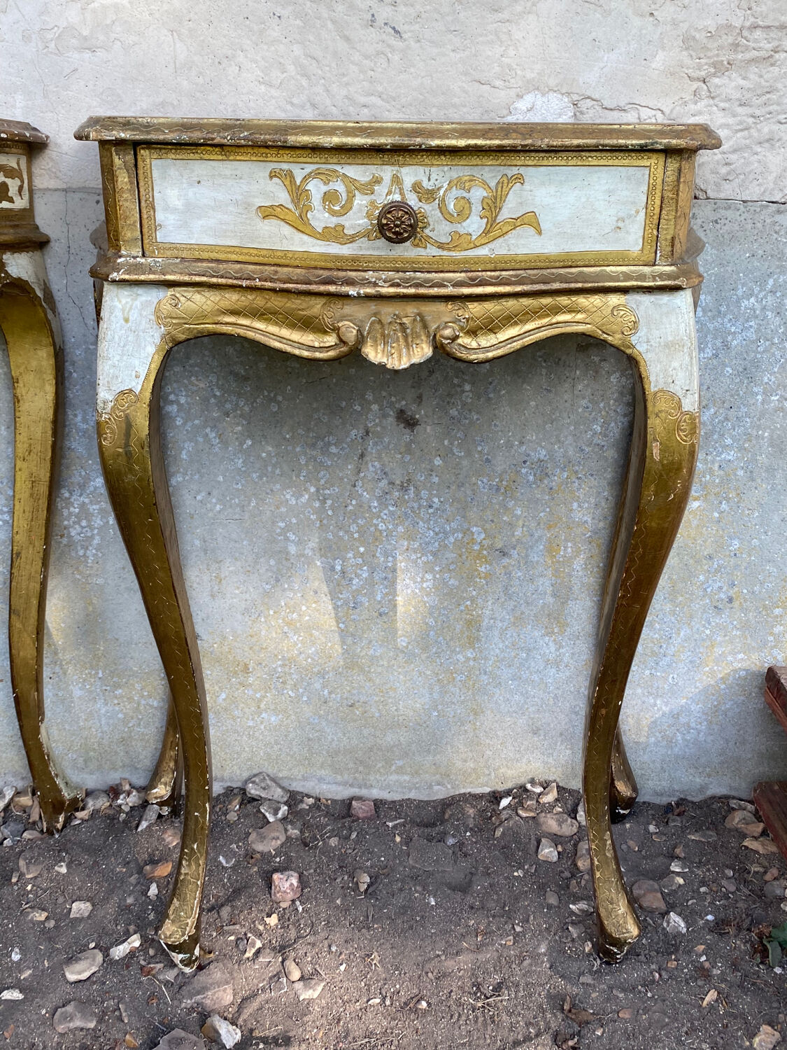 Pairs of Florentine bedside tables in gilded wood.