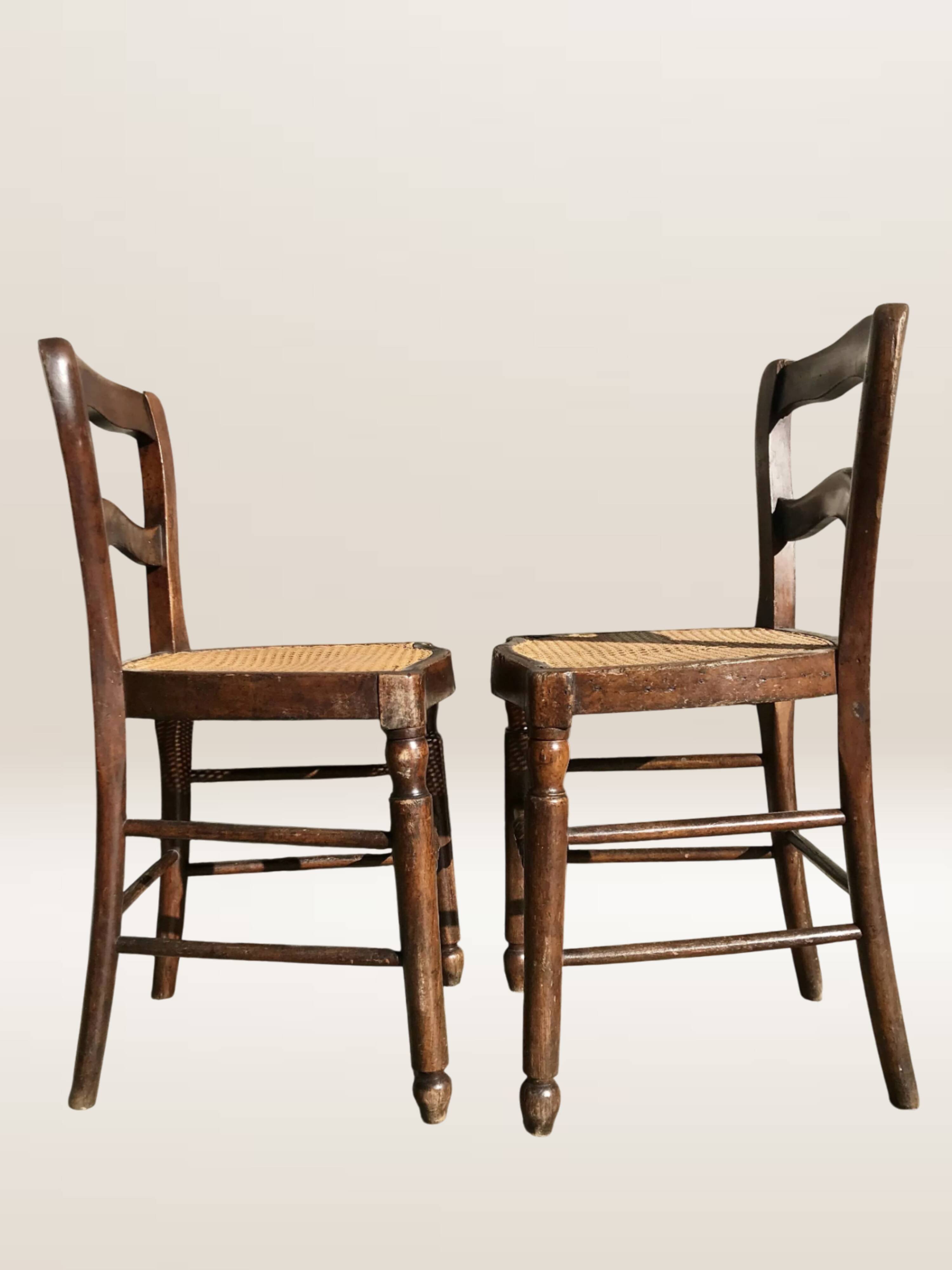 Pair of turned wooden chairs with caning