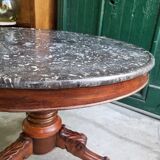Round pedestal table with marble top and mahogany tripod from the 19th century