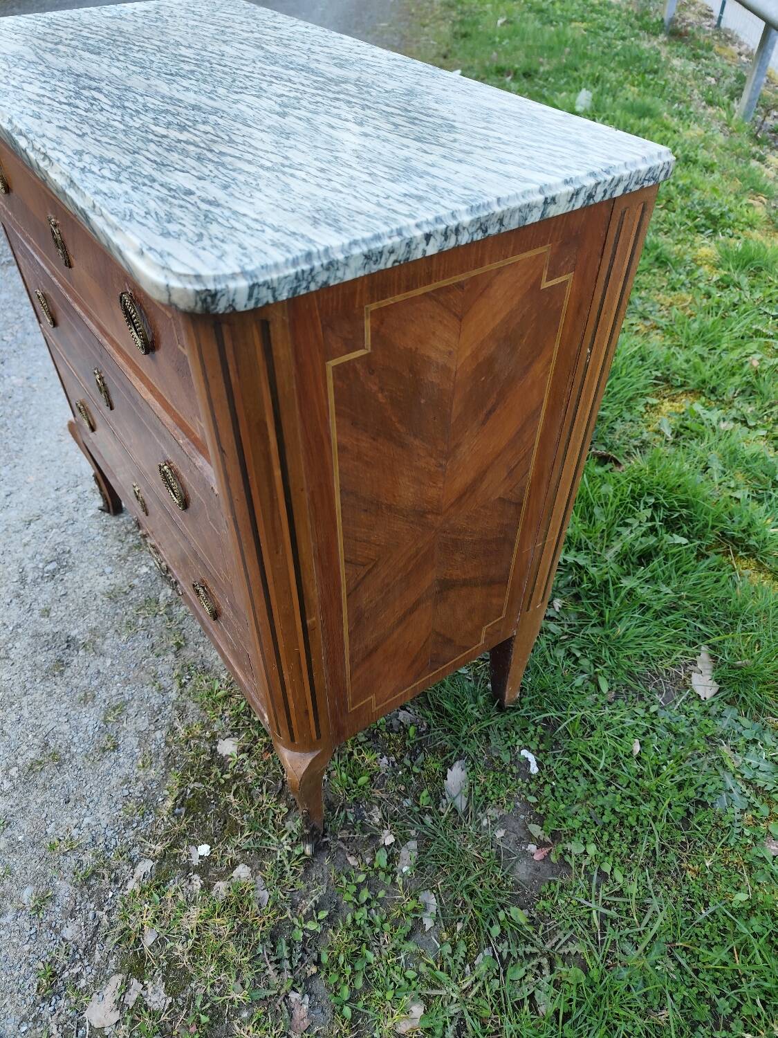Louis XV, Louis XVI transitional style chest of drawers in marble and wood marquetry