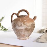 Old water jug. Gargoulette. Old terracotta pitcher.