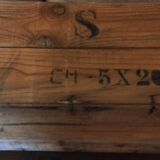 Wooden case with letters in black inck