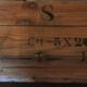 Wooden case with letters in black inck