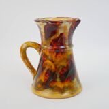 Beautiful ceramic pitcher in fire colors