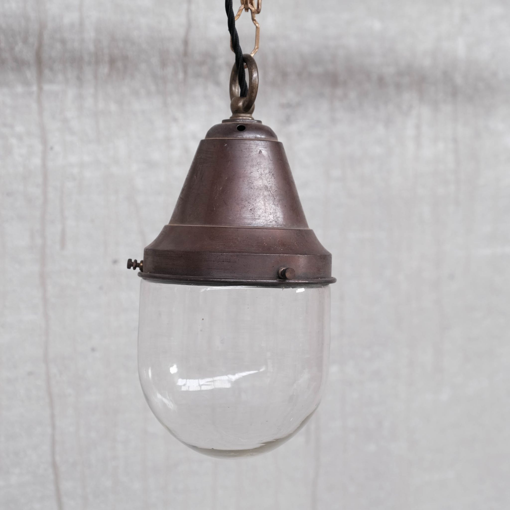 Pair of brass and clear glass industrial pendants