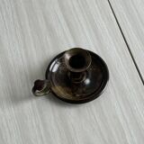 Small antique candle holder in patinated metal