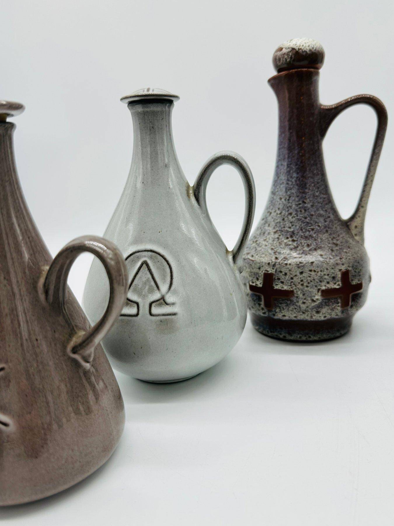 Set of nine modern sculptural ceramic vases from the mid-century, Bauhaus influence.