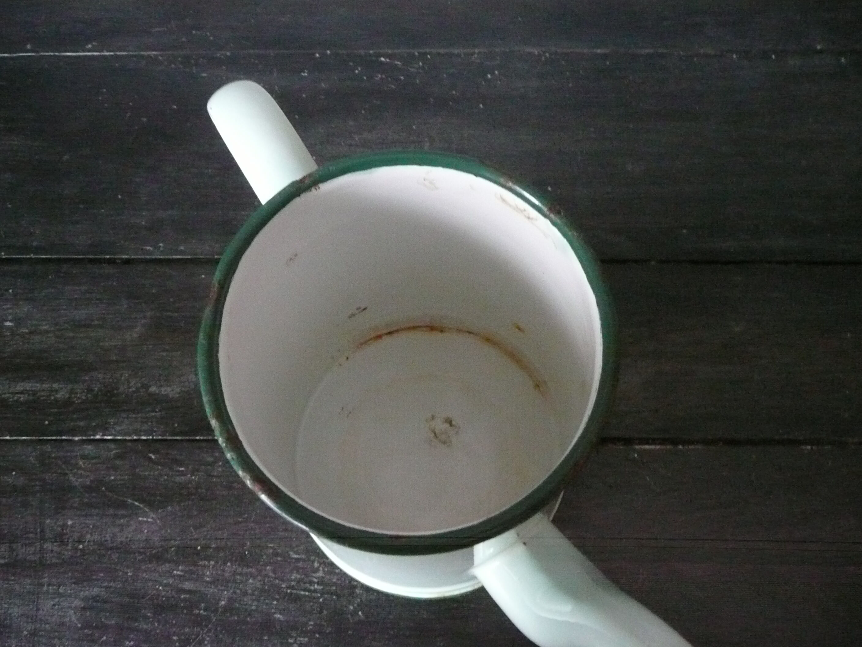 Antique enamelled pitcher