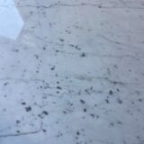 White marble hot water bottle table