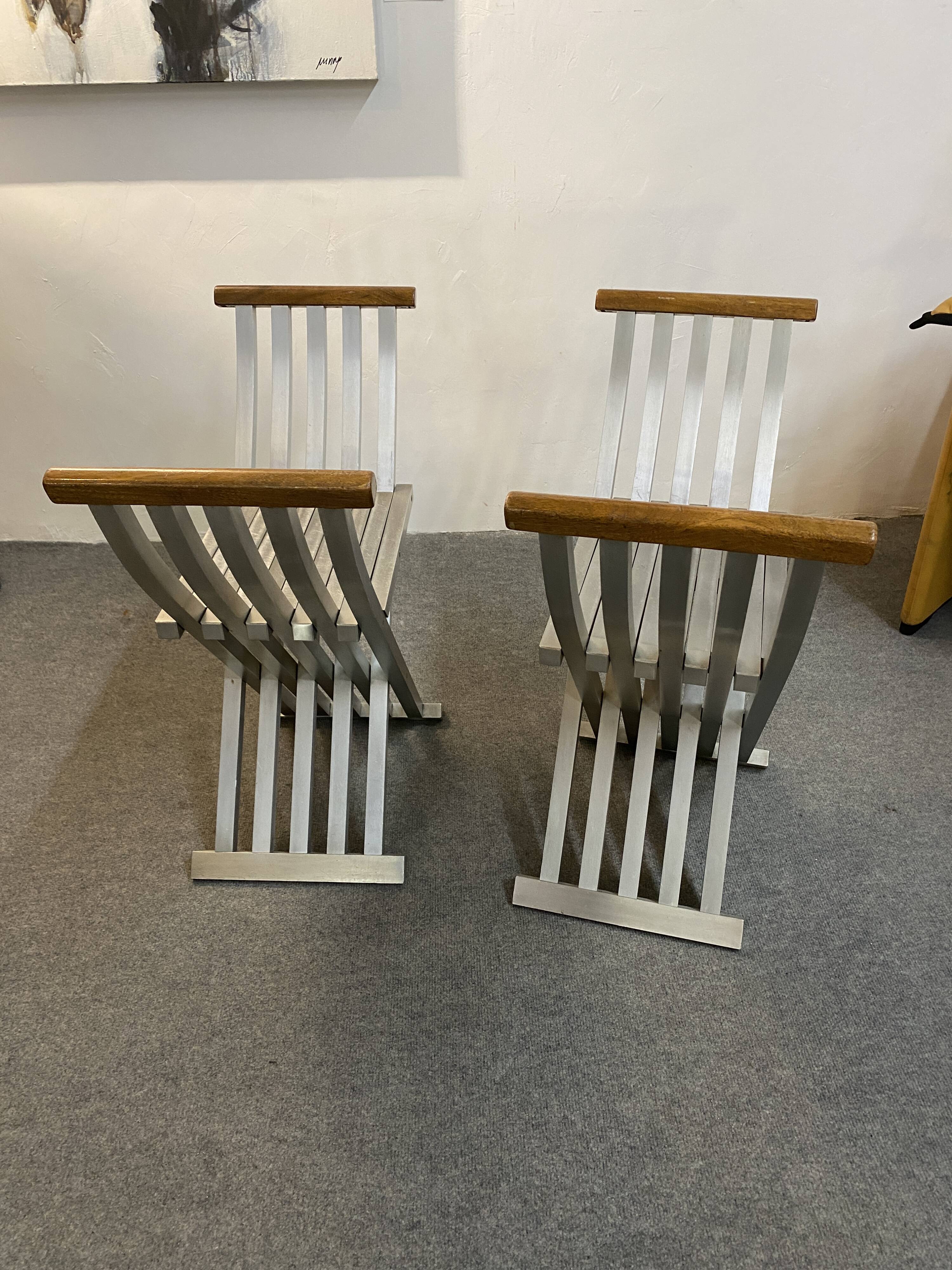 Pair of curule chairs designed by John Vesey, 1958, USA, brushed aluminum, walnut and leather