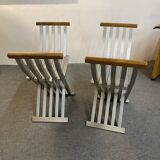 Pair of curule chairs designed by John Vesey, 1958, USA, brushed aluminum, walnut and leather