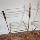 Folding chairs with gold metal structure and methacrylate slats seat and back.