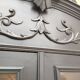 Bookcase black patina shell pediment 2 drawer doors